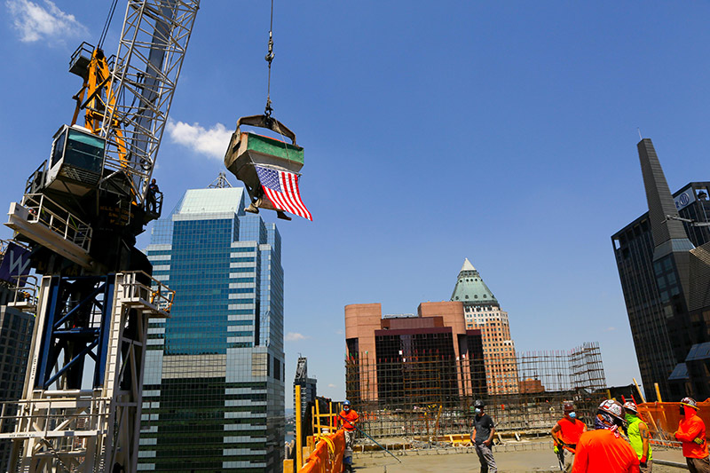 crane flying american flag